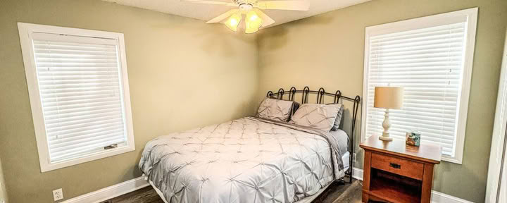 One Queen Bed with Shared Bathroom